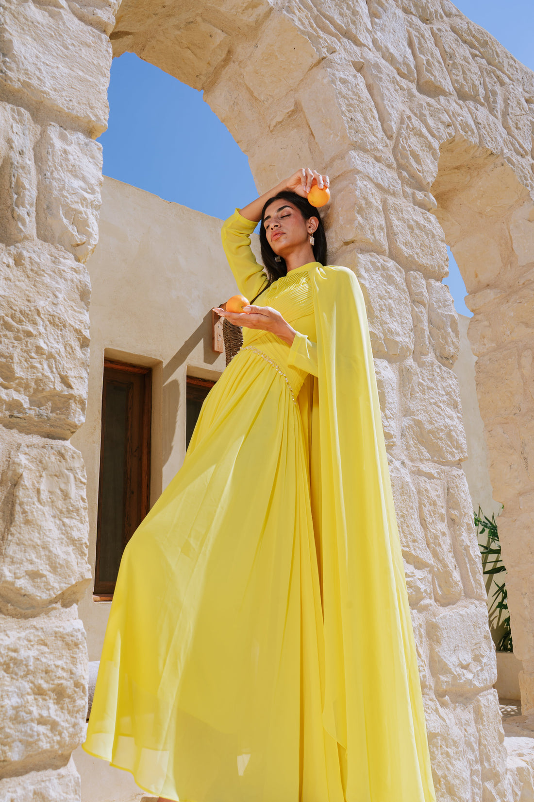 Yellow dress with a stone-embellished waist.