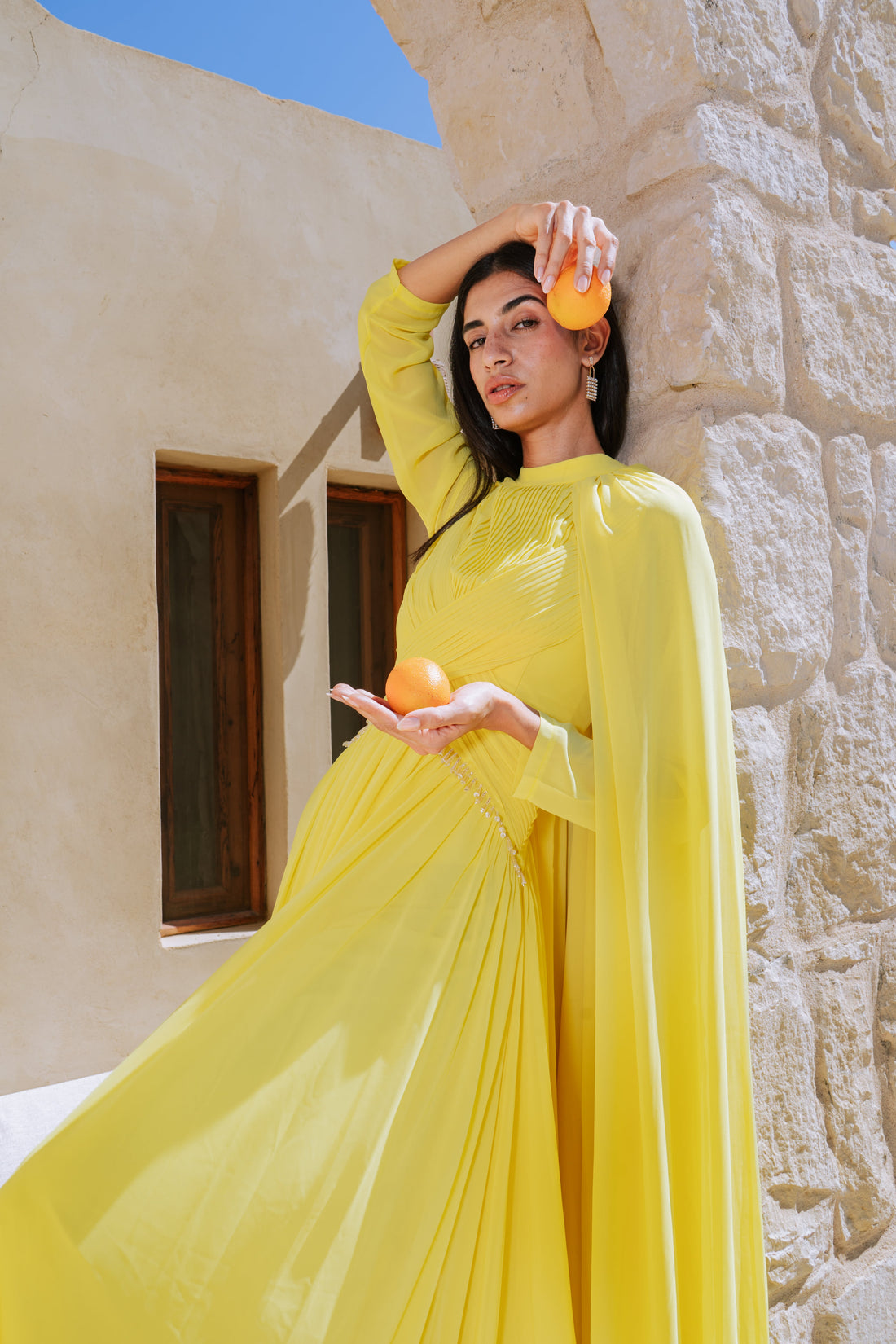 Yellow dress with a stone-embellished waist.